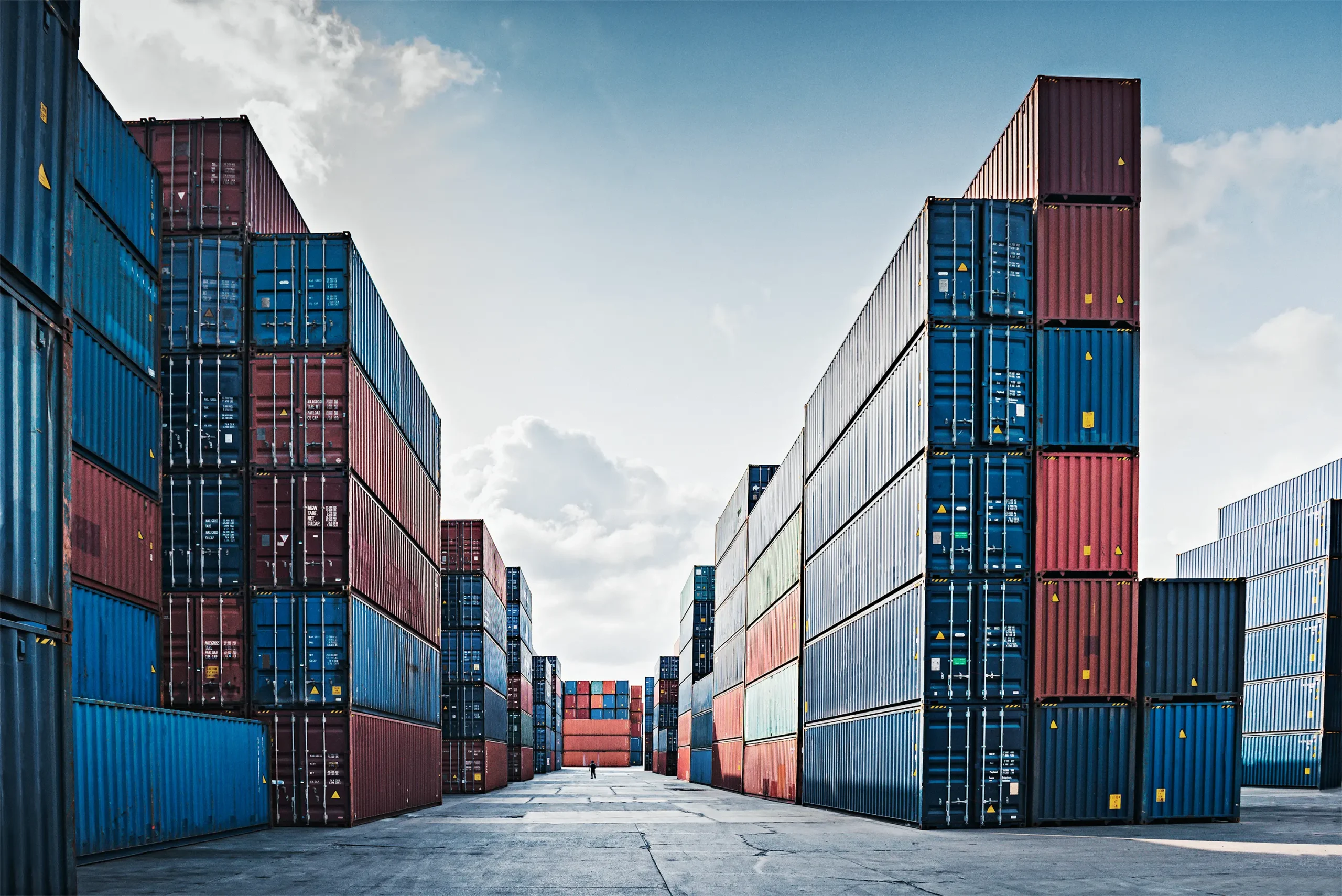 Woman with glasses in front of a group of people