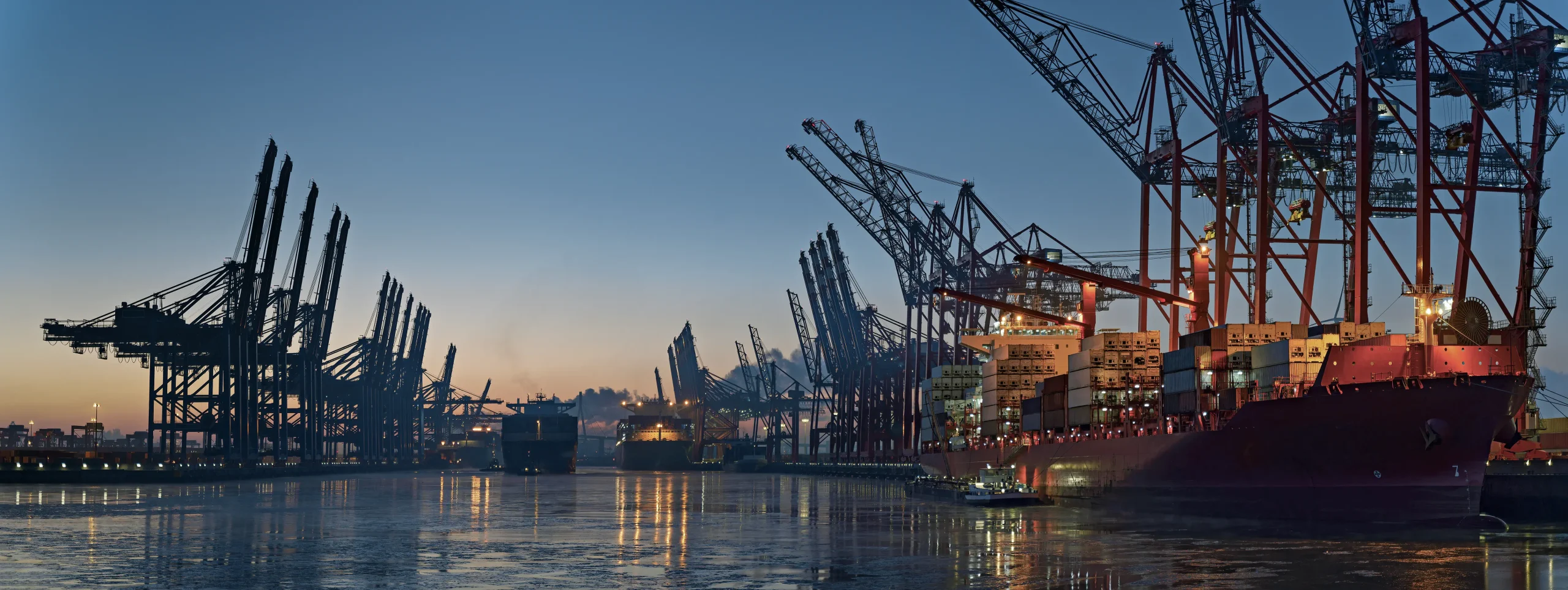 Woman with glasses in front of a group of people